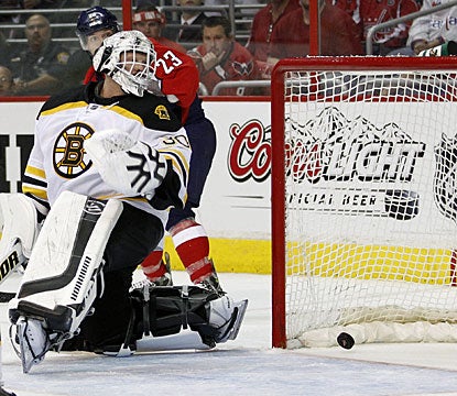 Tim Thomas is unable to stop Alexander Semin's wrist shot during Washington's third power-play opportunity in the game. (AP)