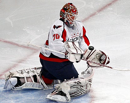 The Capitals' Braden Holtby stops 26 of the 28 shots on goal the Rangers take in Game 2. (AP)