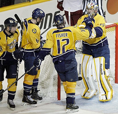 Pekka Rinne gets plenty of credit from his teammates, including Mike Fisher, who scores his first goal this postseason. (AP)