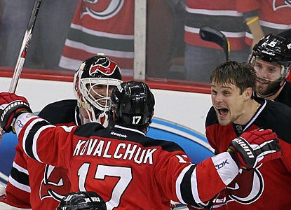 Martin Brodeur, Ilya Kovalchuk and Alexei Ponikarovsky (right) celebrate the big victory. (US Presswire)