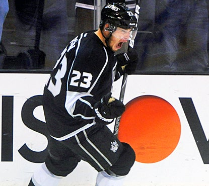 Dustin Brown reacts after scoring an empty-net goal, securing the Kings a spot in the Western Conference finals. (US Presswire)