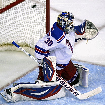 Henrik Lundqvist is beaten high to the glove side by a shot from Alexander Ovechkin for the Capitals' first goal. (AP)