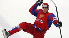 Evgeni Malkin rebounds from a collision with the boards to record a hat trick for Russia.