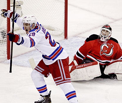 Chris Kreider -- zero NHL regular-season games under his belt -- beats Martin Brodeur for his fifth goal of the playoffs.  (AP)