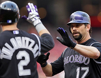 Todd Helton smacks his first home run since April 29 and drives in three runs for the Rockies. (Getty Images)