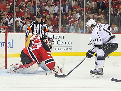 Anze Kopitar gets Martin Brodeur to commit, which makes it easier for the Kings center to score on a breakaway in overtime.  (US Presswire)