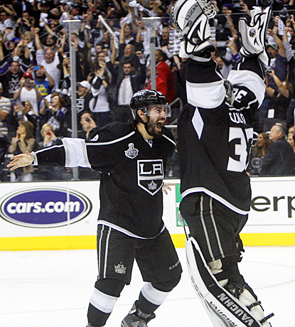 Drew Doughty (left) celebrates with Jonathan Quick after clinching the Stanley Cup in Game 6 against the Devils. (US Presswire)