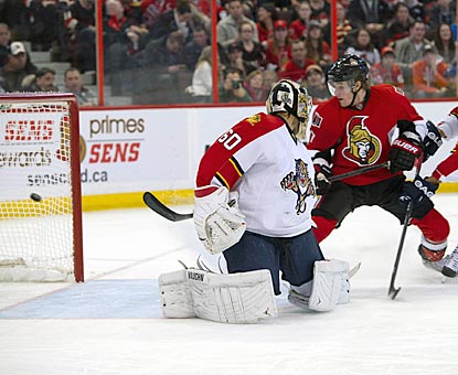Ottawa center Kyle Turris puts the puck past Florida goalie Jose Theodore during the second period. (US Presswire)