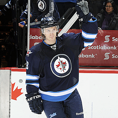 The Jets' Bryan Little breaks a tie game with a power play goal in overtime to cage the Panthers. (Getty Images)
