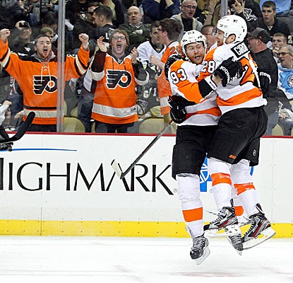 Claude Giroux (right) congratulates Jakub Voracek after Voracek scores the winning goal. (USATSI) 