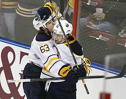 Sabres center Nathan Gerbe (right) scores his first two goals of the season -- both during a wild first period.  (USATSI)