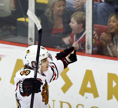 Patrick Kane makes the Blackhawks and some Chicago fans in Detroit very happy with his SO goal.  (AP)