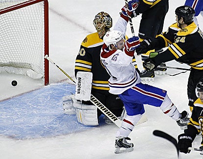 Boston defenseman Adam McQuaid shoves Montreal's David Desharnais but it is too late as Desharnais scores the winner. (USATSI) 