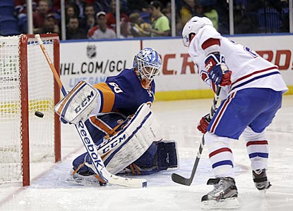 Brian Gionta scores past New York's Kevin Poulin early in the third period to put the Canadiens ahead for good.  (AP)