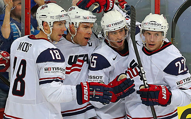 Paul Stastny (second from left) celebrates with teammates after scoring Team USA's first goal. (Getty Images)