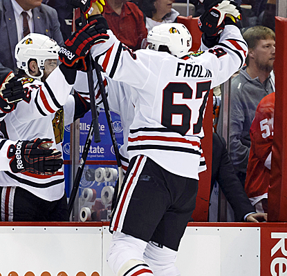 Michael Frolik celebrates one of Chicago's three third-period goals as the series heads for Game 7.  (USATSI)