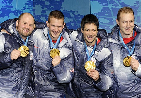 Steven Holcomb (left) and his crew win the first U.S. bobsled gold since 1948.