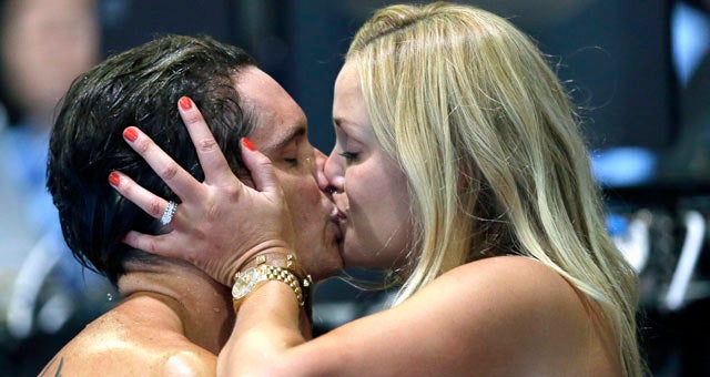 Eric Shanteau kisses his wife, Jeri Moss Shanteau, after placing second and making the Olympic team. (AP)