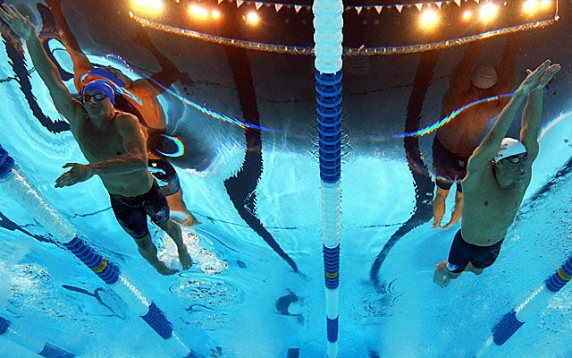 Phelps (right) goes through a hectic night, also competing in the 200 butterfly. (Getty Images)
