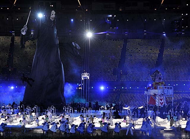 A giant puppet of Lord Voldemort looms over children in a skit at opening ceremonies. (Getty Images)