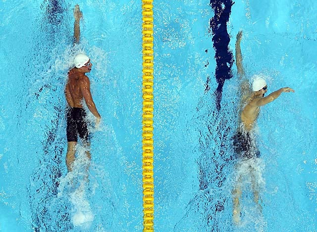 Lochte (left) finishes second to Sun (right), trailing by 21/100ths of a second. (Getty Images)