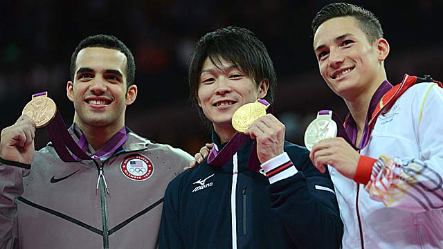 Danell Leyva (left) rallies to finish behind Kohei Uchimura and Marcel Nguyen. (Getty Images)