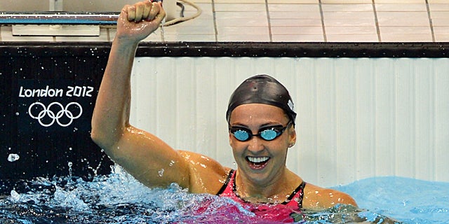 Soni celebrates after setting her world record to reach the 200-meter breaststroke final. (Getty Images)