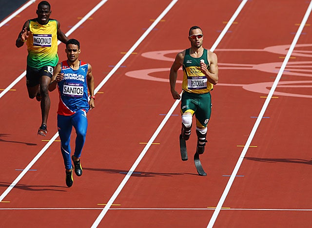 After cruising by a couple of opponents, Pistorius coasts to a second-place finish in his heat. (Getty Images)