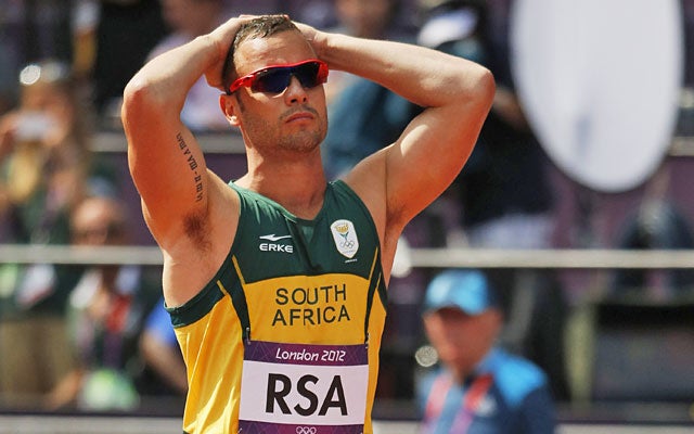 Oscar Pistorius left the track in disappointment after South Africa crashed out of its relay heat. (AP)
