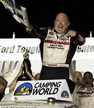 Todd Bodine uses one full tank of fuel for 58 laps, racing to his fourth win this season. (AP)