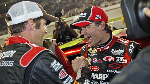 Crew chief Alan Gustafson and Jeff Gordon celebrate after clinching the final spot in the Chase. (AP)