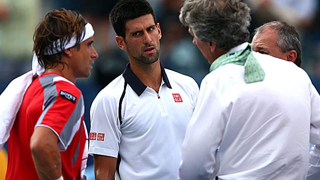 With David Ferrer (left) leading 5-2 after about half-half of action, the match is called. (Getty Images)