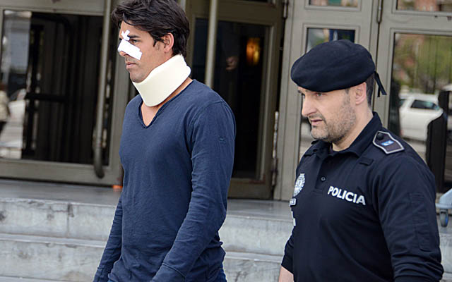 Thomas Drouet, Tomic's training partner, leaves a courthouse in Madrid on Monday. (Getty Images)