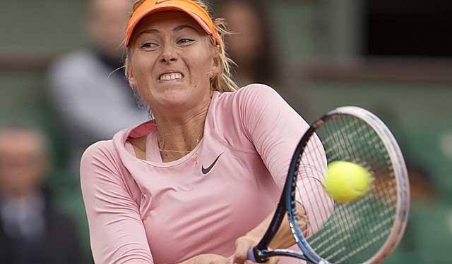Maria Sharapova rips a backhand during her first-round win at Paris. (USATSI)