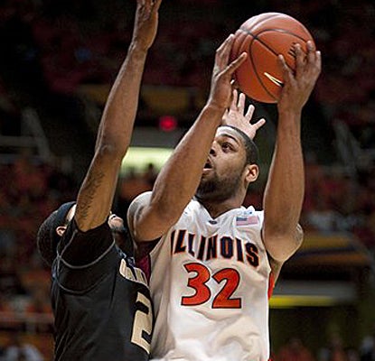 Illinois' Demetri McCamey shoots over Oakland's Larry Wright and finishes the game with 30 points. (AP)