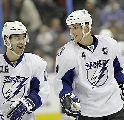 Vincent Lecavalier, right, celebrates his game-winning goal with teammate Teddy Purcell.  (AP)