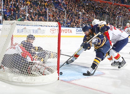 Jason Pominville scores a first-period goal against Panthers goalie Tomas Vokoun to give the Sabres the early lead. (AP)