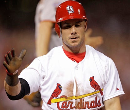 St. Louis' Skip Schumaker reacts after beating out an infield single for the game-winning RBI. (AP)