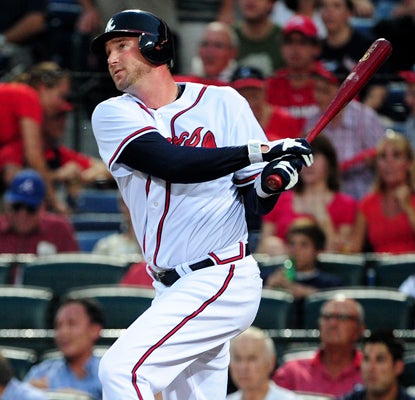 Atlanta's Derek Lowe hits his first career home run in the third inning against the Nationals.  (Getty Images)