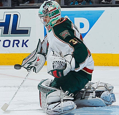 Matt Hackett stops 42 shots in his first NHL start to help Minnesota extend its road win streak to six. (Getty Images)