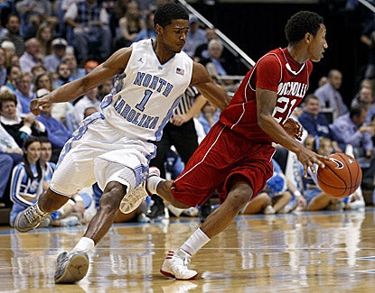 North Carolina's Dexter Strickland, who guards Nicholls State's Shane Rillieux, scores 14 points in the Tar Heels' win. (AP)
