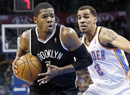 Joe Johnson drives past Oklahoma City's Thabo Sefolosha in the second quarter, during which he scores eight of his 33 points. (AP)