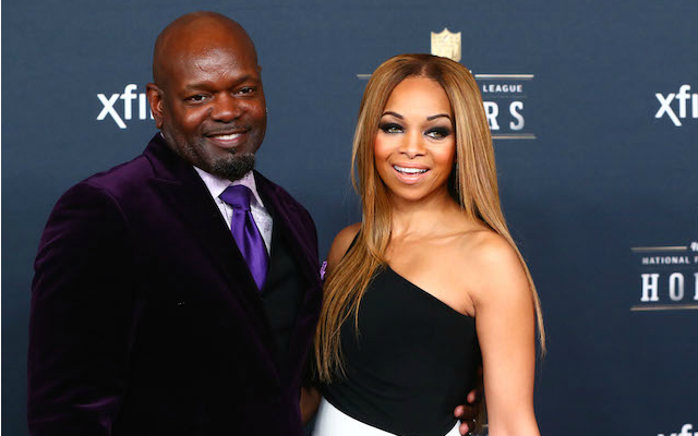 Emmitt Smith (with his wife) is distancing himself from Donald Trump. 