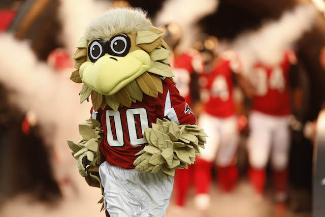 Atlanta Falcons fans pose for photos with team mascot Freddie the