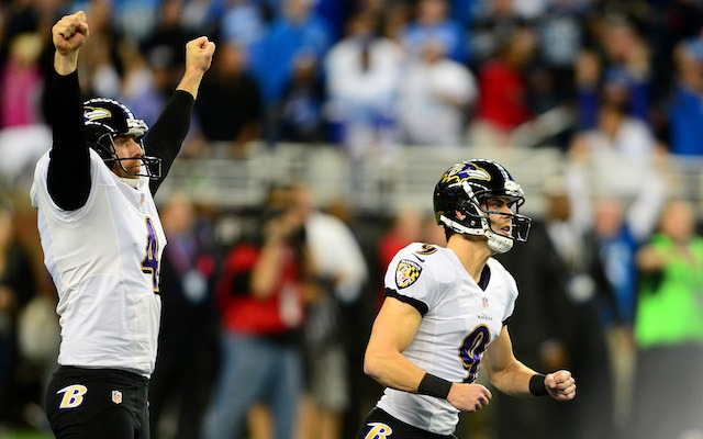 Justin Tucker [right] anxiously watches his 61-yard field goal. (USATSI)