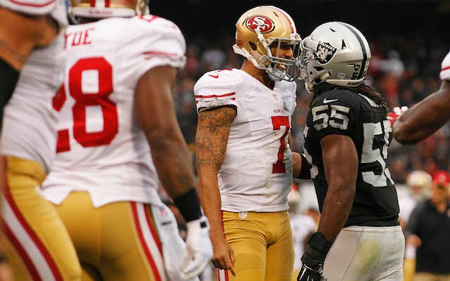 Colin Kaepernick and Sio Moore don't seem to like each other very much. (USATSI)