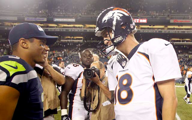 Peyton Manning and Russell Wilson will meet up again Sunday. (USATSI)