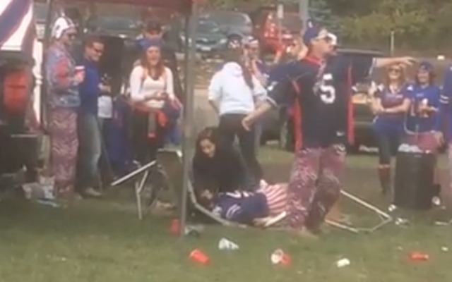 Buffalo Bills fan RKOs his friend through a table at tailgate party