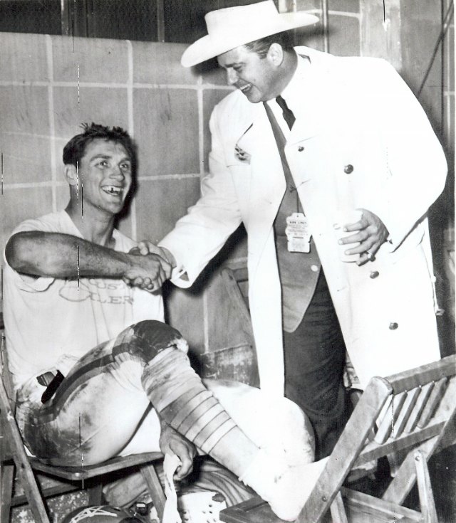 Billy Cannon, the No. 1 pick of two drafts, receives a warm handshake from Bud Adams. (AP/ talesfromtheamericanfootballleague.com)