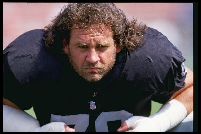 Bob Golic didn't look quite as mean when he hung out with Don Niam. (Getty Images)